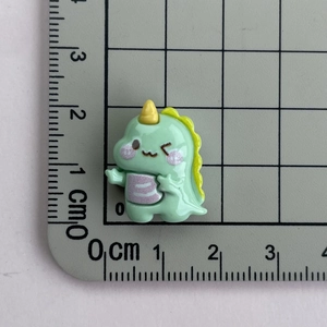 Detailed size view of a 2cm mini green resin dinosaur accessory for DIY crafts