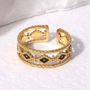 Adjustable gold stainless steel ring featuring black enamel eye and rope edge texture