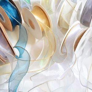Sheer organza ribbons with gold metallic edges in various colors for gift wrapping