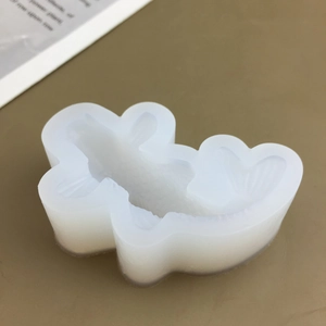 Detailed close-up of translucent silicone fish mold for chocolate and cake decorating