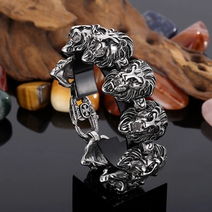 Rugged men's stainless steel lion head bracelet in vintage silver with cross motif clasp
