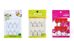 Three packs of six heavy-duty plastic adhesive wall hooks in assorted colors