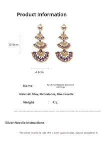 Detailed view of vintage gold fan-shaped earrings with purple rhinestones and 925 silver pins