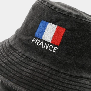 Detailed embroidery of French flag and France text on washed dark grey bucket hat