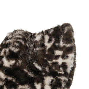 Detailed macro view of soft faux mink fur with leopard print on a warm winter bucket hat