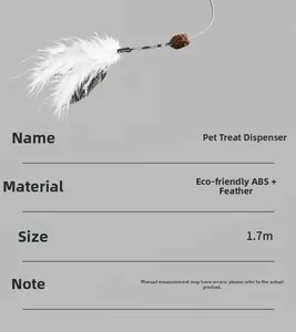 Detail of pet feeder accessory featuring white feathers, catnip ball and elastic cord