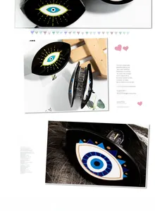 Detailed views of black acrylic evil eye hair claw clip with colorful eye pattern prints