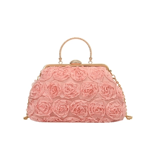 Pink evening bag with 3D floral petals, golden metal handle and a rhinestone clasp