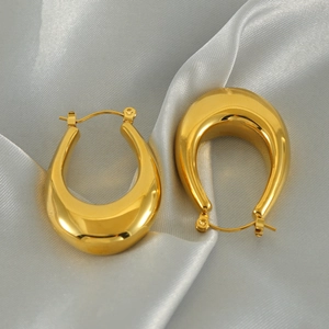 French vintage style gold-plated stainless steel U-shaped earrings on satin fabric