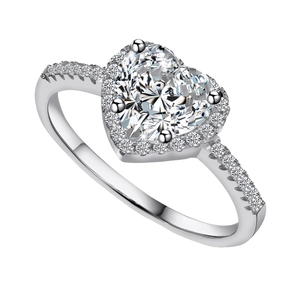 Luxurious heart-shaped engagement ring with halo setting and pavé diamonds on white background