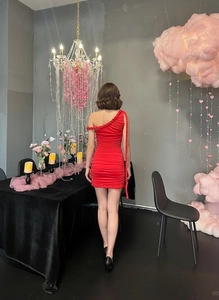 Detailed back view of red one-shoulder ruched mini dress with rope braided trim details
