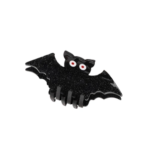 Sparkling black bat hair claw clip with silver glitter and red eyes for Halloween hair accessory