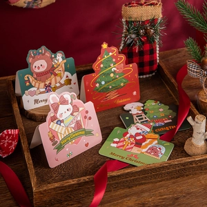 Golden foil Merry Christmas cards set with cute cartoon animals and festive tree designs