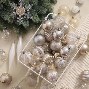 Elegant champagne and white Christmas tree ornament set in a decorative basket