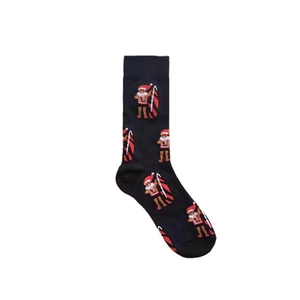 Detail of black cotton socks featuring festive gingerbread man and candy cane patterns