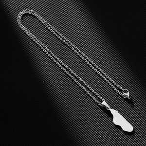 Detail view of Madagascar map pendant with polished silver finish and lobster clasp