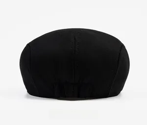 Detail view of cotton newsboy cap back featuring adjustable elastic band for custom fit