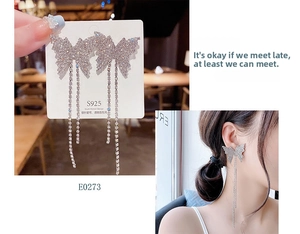 Close-up of S925 silver needle butterfly earrings with long rhinestone tassels
