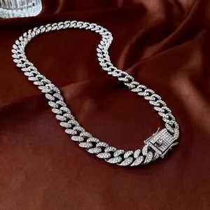 Silver luxury Cuban link chain necklace with sparkling crystals on brown satin