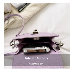 Detail of light purple mini phone bag interior with double compartments and snap button