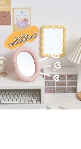 Detail of candy-colored wavy plastic mirrors for desktop and wall hanging decor