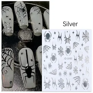 Detailed silver 3D Halloween nail stickers with spider, web, and star patterns