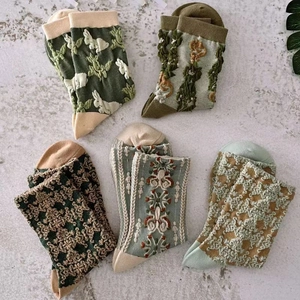 Five pairs of vintage-style embossed floral mid-tube cotton socks in various retro patterns