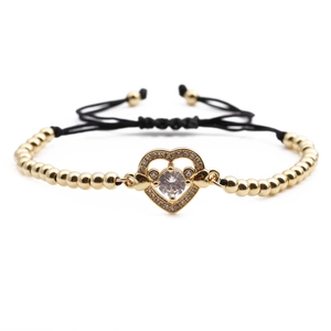 Adjustable gold beaded heart bracelet with cubic zirconia and black drawstring cord