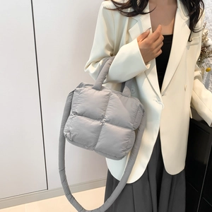 Quilted padded tote bag in grey nylon with adjustable shoulder strap and top handles