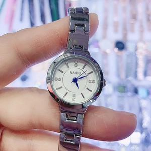 Elegant women's silver bracelet watch with a white dial and sparkling diamond markers