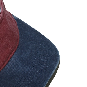 Detail of the navy brim and burgundy top with reinforced stitching on the sun visor