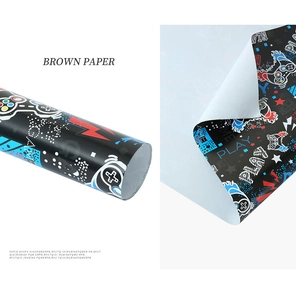 Macro detail of gaming wrapping paper with controller icons and play text design