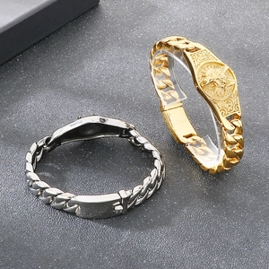 Close-up of gold wolf head bracelet and silver Cuban link chain in 316L stainless steel