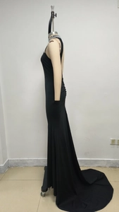 Detail of beaded halter neckline with pearls and crystals on black fishtail dress