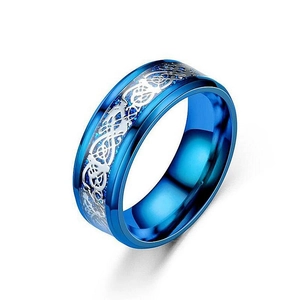 Detailed macro view of blue titanium steel ring with intricate silver dragon pattern