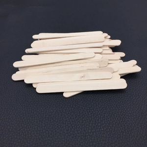 Polished natural wooden craft sticks for DIY molds and resin art on leather surface