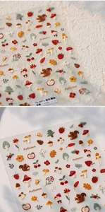 Detail of 5D embossed nail stickers featuring mushrooms and squirrels with autumn forest theme