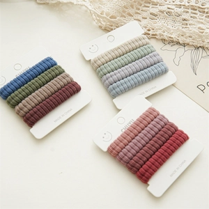 Detailed view of elastic ribbed hair ties in morandi tones with soft texture