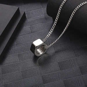 Detailed close-up of a polished silver hex nut pendant on a thin link chain for men and women