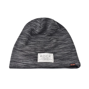 Close-up of a grey knit beanie featuring a white Rock text label and sport side tag