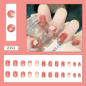 Short press-on nails set with 3D white camellias, pearls, and coral pink gradient finish