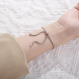 Minimalist adjustable silver snake chain bracelet with sleek metal bead accents for women
