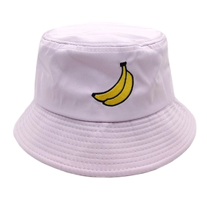 Detail of yellow banana embroidery on a light purple cotton canvas bucket sun hat