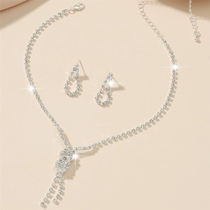Silver rhinestone bridal jewelry set with fringe knot necklace and drop earrings