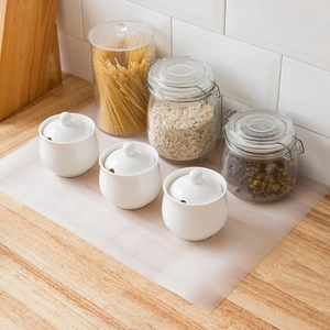 Transparent EVA kitchen drawer liner with anti-slip texture on a wooden countertop