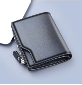 Close-up of black lychee texture leather wallet with silver metal zipper detail