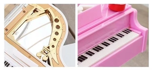 Detail of the piano music box keys and internal golden mechanical musical movement