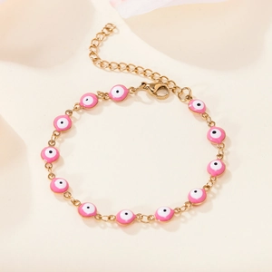 Gold plated stainless steel bracelet featuring pink evil eye enamel charms and lobster clasp