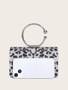 Size comparison of a leopard print rhinestone evening bag with a smartphone