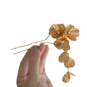 Elegant gold hollow flower hair pin with tassels and metallic brushed finish